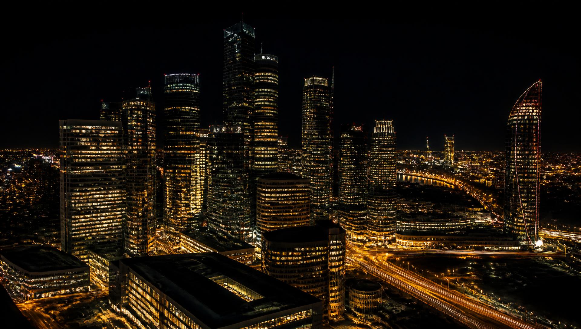 Modern financial district skyline illuminated at night